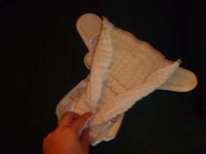 cloth diaper rolled and half unfolded